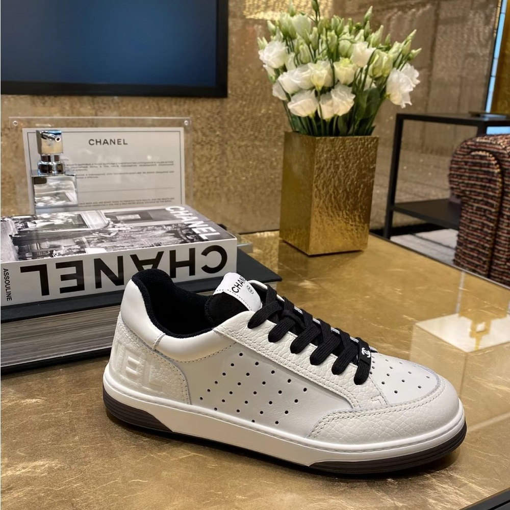Authentic Chanel classic black and white sneakers